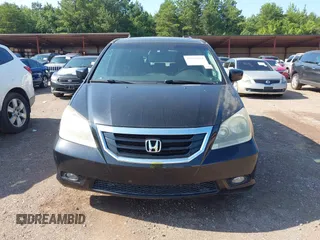 2010 Honda Odyssey Touring with VIN 5FNRL3H97AB104359, listed as a IAAI auction lot 42555872 with 233,952 mi miles and . Bid and sale history available at DreamBid. Image 6.