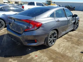 2019 Honda Civic Sport with VIN 19XFC2F82KE019704, listed as a IAAI auction lot 41770051 with 90,011 mi miles and . Bid and sale history available at DreamBid. Image 4.