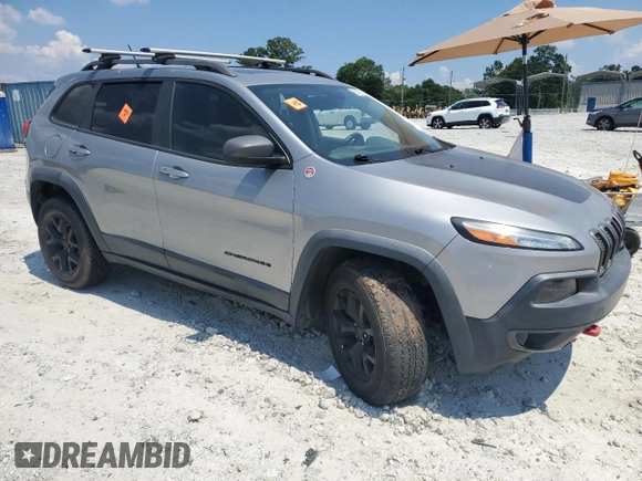 2015 Jeep Cherokee Trailhawk with VIN 1C4PJMBS3FW735398, listed as a Copart auction lot 63700015 with 157,123 mi miles and Clean title. Bid and sale history available at DreamBid. Image 4.