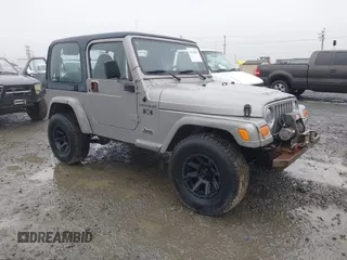 2002 Jeep Wrangler X z VIN 1J4FA39S72P726827, wystawiony jako IAAI lot #41341856 z przebiegiem 231 143 mil mil oraz . Historia ofert i sprzedaży dostępna na DreamBid. Obrazek 1.