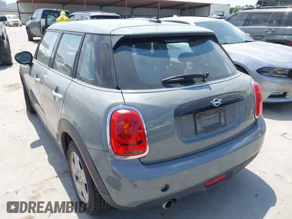 2021 MINI Hardtop 4 Door Oxford Edition with VIN WMWXU7C09M2P17351, listed as a IAAI auction lot 42330197 with 51,628 mi miles and . Bid and sale history available at DreamBid. Image 3.