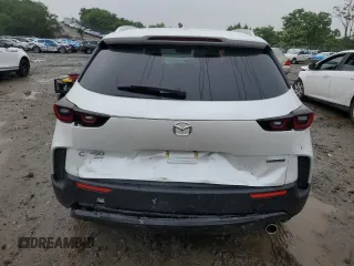 2025 Mazda CX-50 S Premium z VIN 7MMVABDM9SN331032, wystawiony jako Copart lot #60797015 z przebiegiem 9 572 mil mil oraz Nie do naprawy • Non repairable. Historia ofert i sprzedaży dostępna na DreamBid. Obrazek 6.
