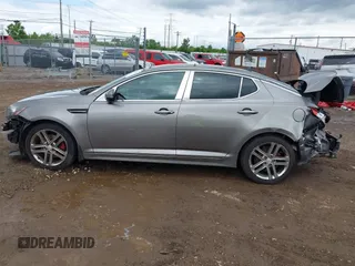 2013 Kia Optima SX z VIN 5XXGR4A65DG120332, wystawiony jako IAAI lot #42323216 z przebiegiem Nie podano mil oraz . Historia ofert i sprzedaży dostępna na DreamBid. Obrazek 14.