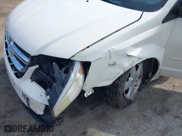 2012 Dodge Grand Caravan SXT with VIN 2C4RDGCGXCR358794, listed as a IAAI auction lot 42007316 with 212,518 mi miles and . Bid and sale history available at DreamBid. Image 6.