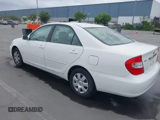 2004 Toyota Camry LE with VIN 4T1BE32K84U362436, listed as a IAAI auction lot 42134510 with 199,371 mi miles. Bid and sale history available at carsss.com. Image 3.