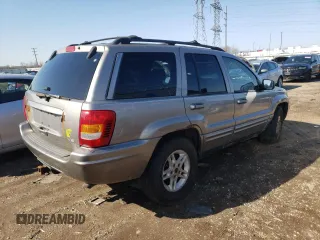 1999 Jeep Grand Cherokee Limited with VIN 1J4GW68N8XC770353, listed as a Copart auction lot 74670614 with Not provided miles and Non repairable. Bid and sale history available at DreamBid. Image 3.