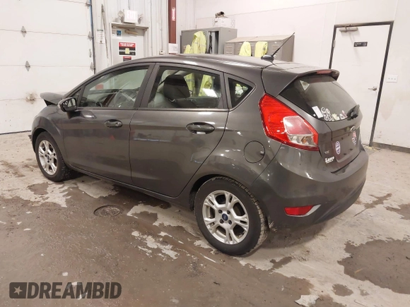 2015 Ford Fiesta SE z VIN 3FADP4EJ8FM138306, wystawiony jako IAAI lot #41227124 z przebiegiem 106 741 mil mil oraz . Historia ofert i sprzedaży dostępna na DreamBid. Obrazek 3.