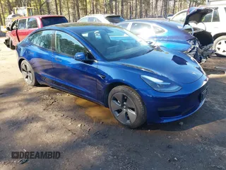 2021 Tesla Model 3 Standard Range Plus z VIN 5YJ3E1EA2MF087140, wystawiony jako IAAI lot #41689033 z przebiegiem 27 755 mil mil oraz . Historia ofert i sprzedaży dostępna na DreamBid. Obrazek 1.