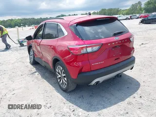 2020 Ford Escape Titanium z VIN 1FMCU9J92LUA39457, wystawiony jako IAAI lot #42222441 z przebiegiem 107 148 mil mil oraz . Historia ofert i sprzedaży dostępna na DreamBid. Obrazek 3.