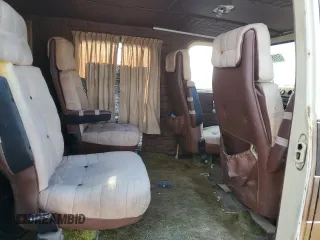1979 GMC Vandura z VIN TGR2597506100, wystawiony jako Copart lot #51086615 z przebiegiem 25 002 mil mil oraz Tytuł czysty. Historia ofert i sprzedaży dostępna na DreamBid. Obrazek 11.