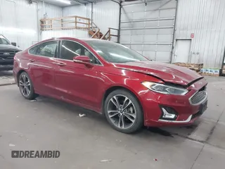 2019 Ford Fusion Titanium with VIN 3FA6P0D91KR204409, listed as a IAAI auction lot 40668554 with 142,277 mi miles and . Bid and sale history available at DreamBid. Image 1.