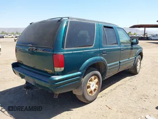 1996 Oldsmobile Bravada z VIN 1GHDT13W5T2711291, wystawiony jako IAAI lot #42502672 z przebiegiem 219 062 mil mil oraz . Historia ofert i sprzedaży dostępna na DreamBid. Obrazek 4.