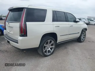 2015 Cadillac Escalade Premium z VIN 1GYS4CKJ4FR216873, wystawiony jako IAAI lot #41677234 z przebiegiem 128 990 mil mil oraz . Historia ofert i sprzedaży dostępna na DreamBid. Obrazek 4.