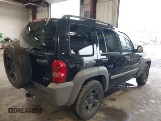 2003 Jeep Liberty Sport with VIN 1J4GL48K53W583860, listed as a IAAI auction lot 41632528 with 162,235 mi miles. Bid and sale history available at carsss.com. Image 4.