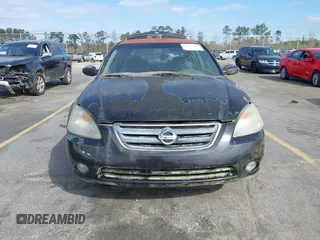 2002 Nissan Altima S with VIN 1N4AL11D52C178433, listed as a IAAI auction lot 41792610 with 216,659 mi miles. Bid and sale history available at carsss.com. Image 6.