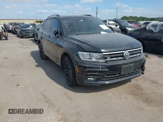 2021 Volkswagen Tiguan SE with VIN 3VV3B7AX1MM014795, listed as a IAAI auction lot 42039299 with 63,661 mi miles and . Bid and sale history available at DreamBid. Image 1.