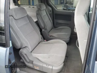 2005 Ford Freestar SE z VIN 2FMDA51605BA50204, wystawiony jako Copart lot #56002955 z przebiegiem 212 942 mil mil oraz Szkody całkowita. Historia ofert i sprzedaży dostępna na DreamBid. Obrazek 11.
