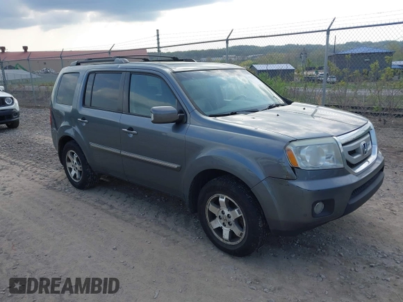 2011 Honda Pilot Touring with VIN 5FNYF4H90BB103824, listed as a IAAI auction lot 42127137 with 243,858 mi miles and . Bid and sale history available at carsss.com. Image 1.