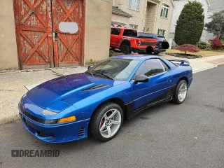 1991 Mitsubishi 3000GT z VIN JA3XD64BXMY005438, wystawiony jako Copart lot #83922384 z przebiegiem 104 951 mil mil oraz Tytuł czysty. Historia ofert i sprzedaży dostępna na DreamBid. Obrazek 2.