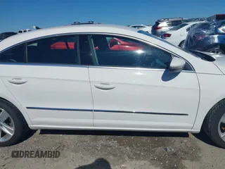 2013 Volkswagen CC Sport z VIN WVWAP7AN7DE545141, wystawiony jako IAAI lot #42325238 z przebiegiem 170 478 mil mil oraz . Historia ofert i sprzedaży dostępna na DreamBid. Obrazek 14.
