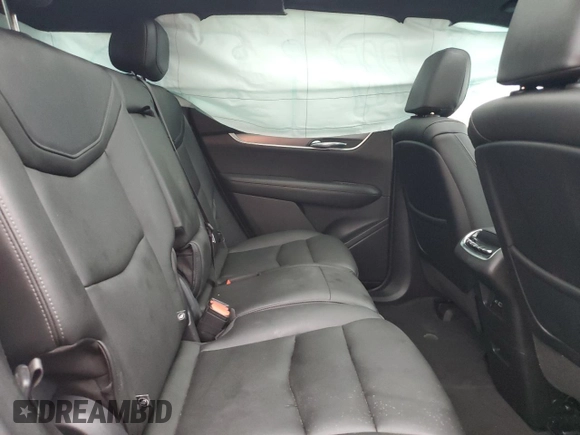 2021 Cadillac XT6 Luxury z VIN 1GYKPAR46MZ132157, wystawiony jako Copart lot #83911054 z przebiegiem 59 473 mil mil oraz Czysty tytuł • Clean title. Historia ofert i sprzedaży dostępna na DreamBid. Obrazek 11.