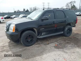 2013 GMC Yukon SLT with VIN 1GKS2CE01DR135135, listed as a IAAI auction lot 41828474 with 180,347 mi miles. Bid and sale history available at carsss.com. Image 2.