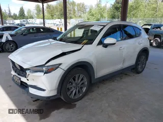 2020 Mazda CX-5 Grand Touring with VIN JM3KFBDM2L0863944, listed as a IAAI auction lot 42150805 with 63,932 mi miles and . Bid and sale history available at DreamBid. Image 17.