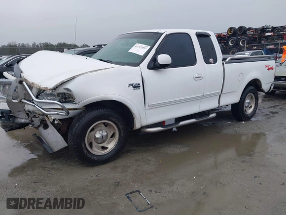 1999 Ford F-150 XL with VIN 1FTRX18L6XNB48352, listed as a IAAI auction lot 41717057 with 171,654 mi miles. Bid and sale history available at carsss.com. Image 2.