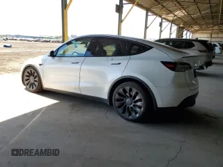 2022 Tesla Model Y Performance z VIN 7SAYGDEF0NF337959, wystawiony jako Copart lot #56871985 z przebiegiem 54 527 mil mil oraz Szkoda całkowita • Salvage title. Historia ofert i sprzedaży dostępna na DreamBid. Obrazek 2.