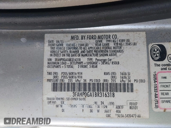 2011 Ford Fusion S with VIN 3FAHP0GA1BR316318, listed as a IAAI auction lot 41824086 with 122,229 mi miles. Bid and sale history available at carsss.com. Image 9.