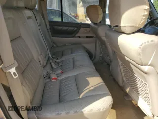 1999 Toyota Land Cruiser z VIN JT3HT05J0X0039052, wystawiony jako Copart lot #54229355 z przebiegiem 228 216 mil mil oraz Czysty tytuł • Clean title. Historia ofert i sprzedaży dostępna na DreamBid. Obrazek 11.