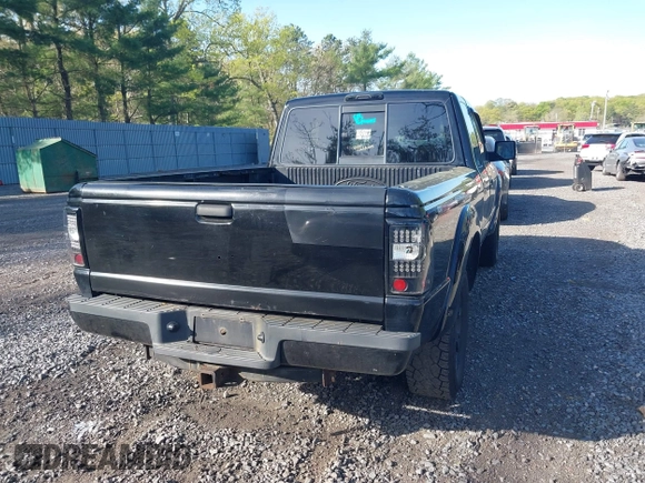 2011 Ford Ranger XLT with VIN 1FTLR4FE9BPB07796, listed as a IAAI auction lot 42128597 with 235,512 mi miles. Bid and sale history available at carsss.com. Image 4.