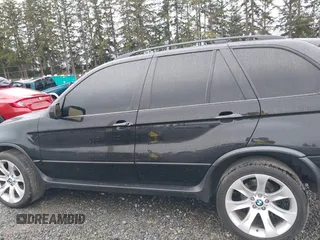 2005 BMW X5 4.8is with VIN 5UXFA93515LE82570, listed as a IAAI auction lot 41759657 with 212,687 mi miles. Bid and sale history available at carsss.com. Image 14.