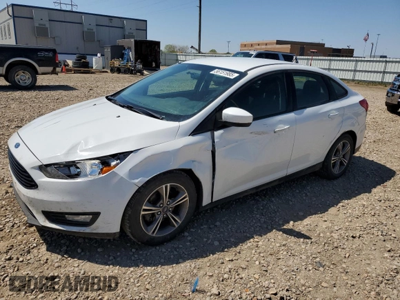 2018 Ford Focus SE with VIN 1FADP3FE0JL227146, listed as a Copart auction lot 56151985 with 124,517 mi miles and Salvage title. Bid and sale history available at DreamBid. Image 1.