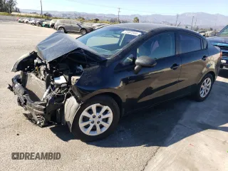 2014 Kia Rio LX with VIN KNADM4A35E6407058, listed as a Copart auction lot 72997044 with 76,215 mi miles and Salvage Title. Bid and sale history available at DreamBid. Image 1.
