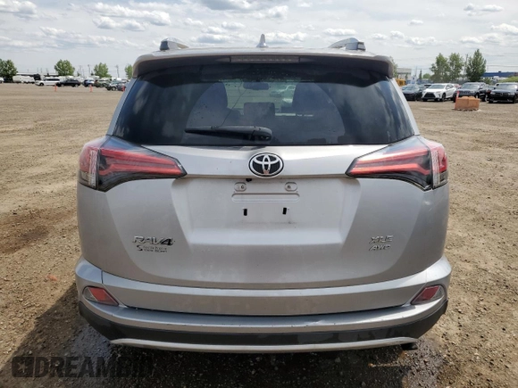 2016 Toyota RAV4 XLE with VIN 2T3RFREV9GW439315, listed as a Copart auction lot 59704345 with 143,198 mi miles and Salvage title. Bid and sale history available at DreamBid. Image 6.