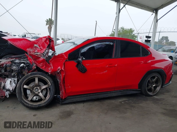 2022 Subaru WRX Premium z VIN JF1VBAF68N9026422, wystawiony jako IAAI lot #42418514 z przebiegiem 22 297 mil mil oraz . Historia ofert i sprzedaży dostępna na DreamBid. Obrazek 14.