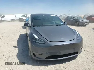 2023 Tesla Model Y Long Range z VIN 7SAYGDEE8PA185193, wystawiony jako Copart lot #48706215 z przebiegiem 10 451 mil mil oraz Szkoda całkowita • Salvage title. Historia ofert i sprzedaży dostępna na DreamBid. Obrazek 10.