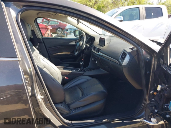 2018 Mazda 3 Touring with VIN 3MZBN1L34JM164952, listed as a IAAI auction lot 42179420 with 106,706 mi miles and . Bid and sale history available at DreamBid. Image 5.
