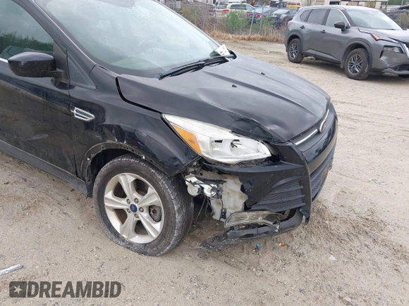2016 Ford Escape SE with VIN 1FMCU9G99GUC13053, listed as a IAAI auction lot 41888535 with 84,019 mi miles. Bid and sale history available at carsss.com. Image 6.