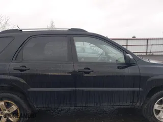 2009 Kia Sportage LX with VIN KNDJE723497612745, listed as a IAAI auction lot 41974301 with 141,110 mi miles. Bid and sale history available at carsss.com. Image 13.