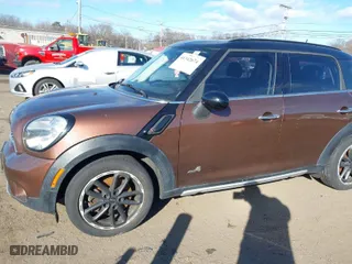 2015 MINI Cooper Countryman S with VIN WMWZC5C55FWP47826, listed as a IAAI auction lot 41342674 with 94,683 mi miles. Bid and sale history available at carsss.com. Image 12.