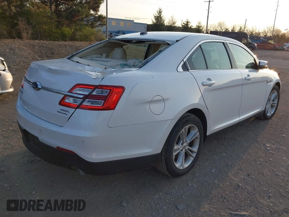 2015 Ford Taurus SEL with VIN 1FAHP2E82FG202143, listed as a IAAI auction lot 42053737 with 113,839 mi miles and . Bid and sale history available at carsss.com. Image 4.