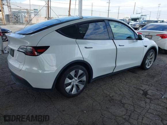 2023 Tesla Model Y Long Range with VIN 7SAYGAEE7PF607195, listed as a IAAI auction lot 41819147 with 74,694 mi miles. Bid and sale history available at carsss.com. Image 4.