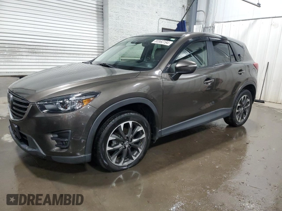 2016 Mazda CX-5 Grand Touring with VIN JM3KE4DY4G0600877, listed as a Copart auction lot 85560194 with 82,395 mi miles and Salvage Title. Bid and sale history available at carsss.com. Image 1.