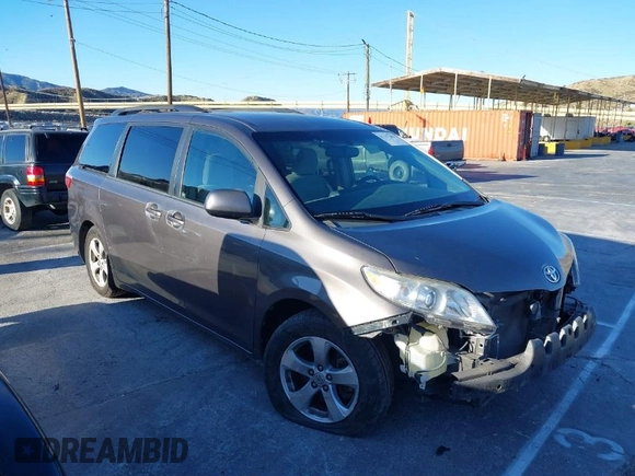 2015 Toyota Sienna LE AAS with VIN 5TDKK3DC3FS529845, listed as a IAAI auction lot 41627102 with 130,334 mi miles. Bid and sale history available at carsss.com. Image 1.
