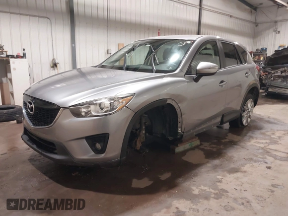 2015 Mazda CX-5 Grand Touring with VIN JM3KE4DY2F0477966, listed as a IAAI auction lot 41247178 with 116,582 mi miles. Bid and sale history available at carsss.com. Image 18.