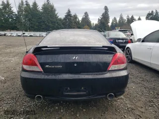 2006 Hyundai Tiburon GS with VIN KMHHM65DX6U225464, listed as a Copart auction lot 83561984 with 182,245 mi miles and Salvage Title. Bid and sale history available at carsss.com. Image 6.