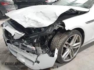2014 BMW 6 Series 650i xDrive z VIN WBA6B4C55ED371378, wystawiony jako IAAI lot #41640888 z przebiegiem 80 927 mil mil oraz . Historia ofert i sprzedaży dostępna na DreamBid. Obrazek 6.