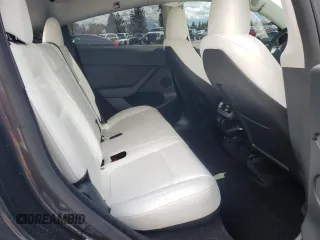 2024 Tesla Model Y z VIN 7SAYGDED1RF089192, wystawiony jako Copart lot #48752085 z przebiegiem 7 643 mil mil oraz Szkoda całkowita • Salvage title. Historia ofert i sprzedaży dostępna na DreamBid. Obrazek 11.